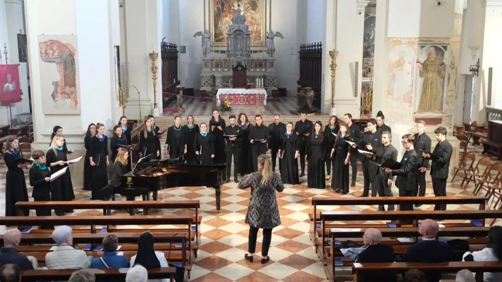 Wide shot of the choir performing in an ancient church in Pordenone