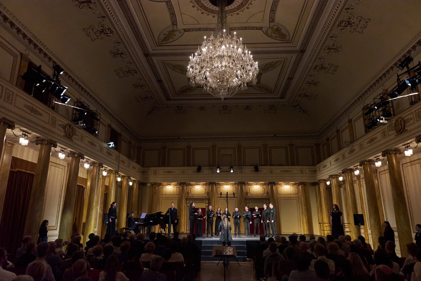 Wide shot picture of the Vikra Chamber Choir performing in Teatro Verdi of Trieste